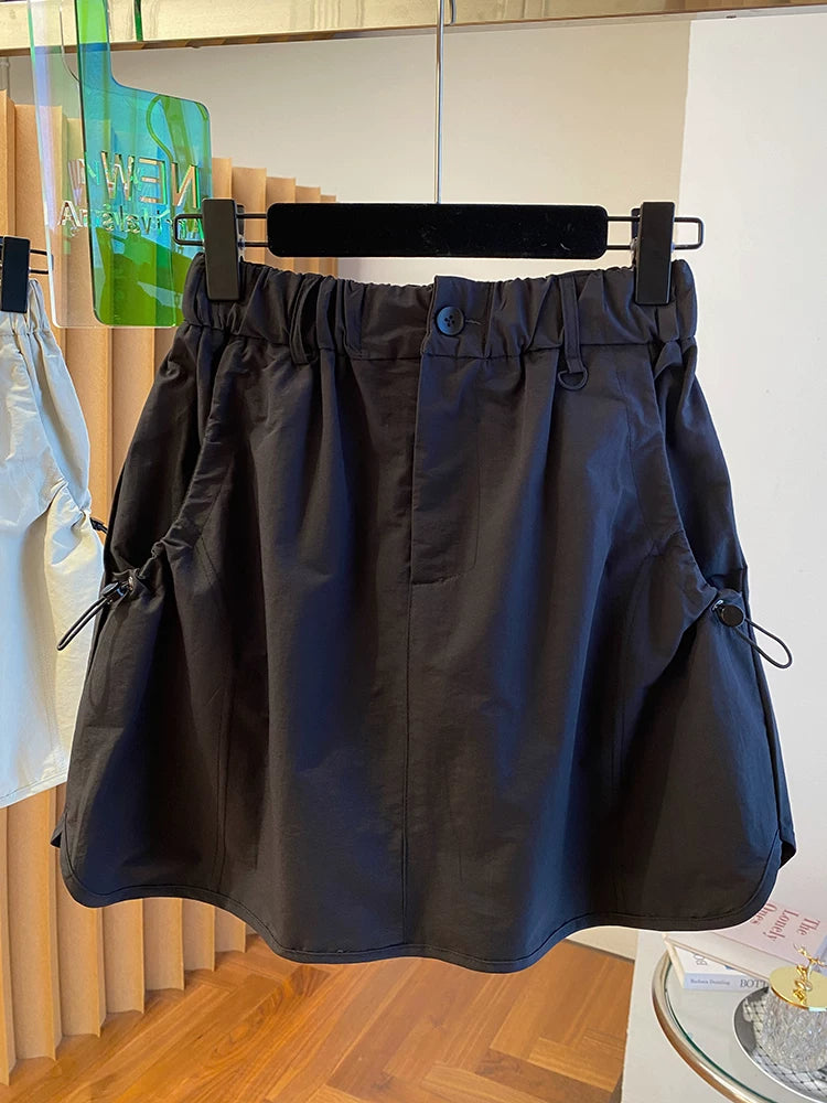 Chân Váy Ngắn Workwear Cạp Cao – Dáng Bao Mông Chống Lộ, Hè 2026