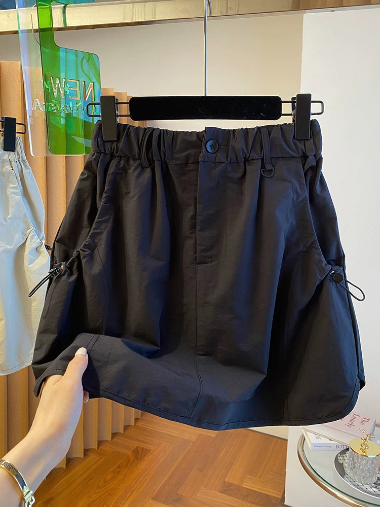 Chân Váy Ngắn Workwear Cạp Cao – Dáng Bao Mông Chống Lộ, Hè 2026