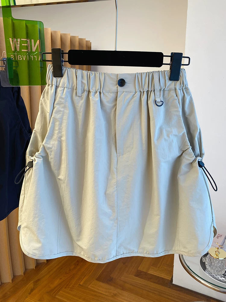 Chân Váy Ngắn Workwear Cạp Cao – Dáng Bao Mông Chống Lộ, Hè 2026